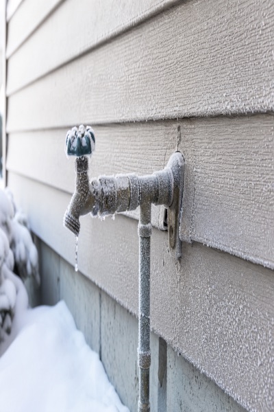 Frozen outdoor water pipes in winter